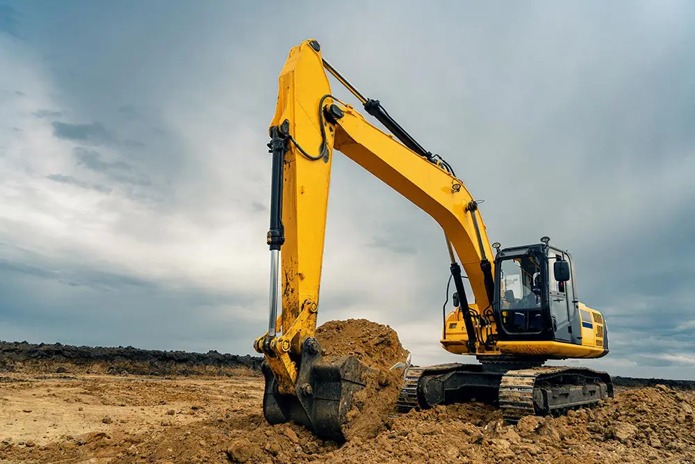 construction-insurance-large-construction-excavator-yellow-sjl-insurance-services