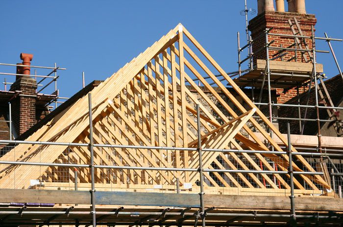 Photo of building roof timbers and scaffolding