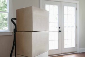 Boxes stacked in empty house Probate Property Insurance