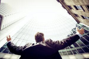 man in front of a building