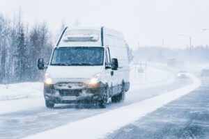 Mini van at the Snowy Winter Road