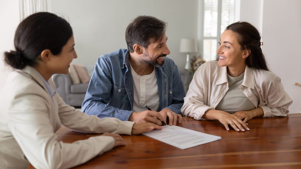 a couple signing a contract