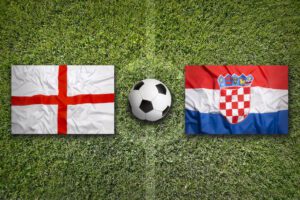 England vs. Croatia flags on a green soccer field
